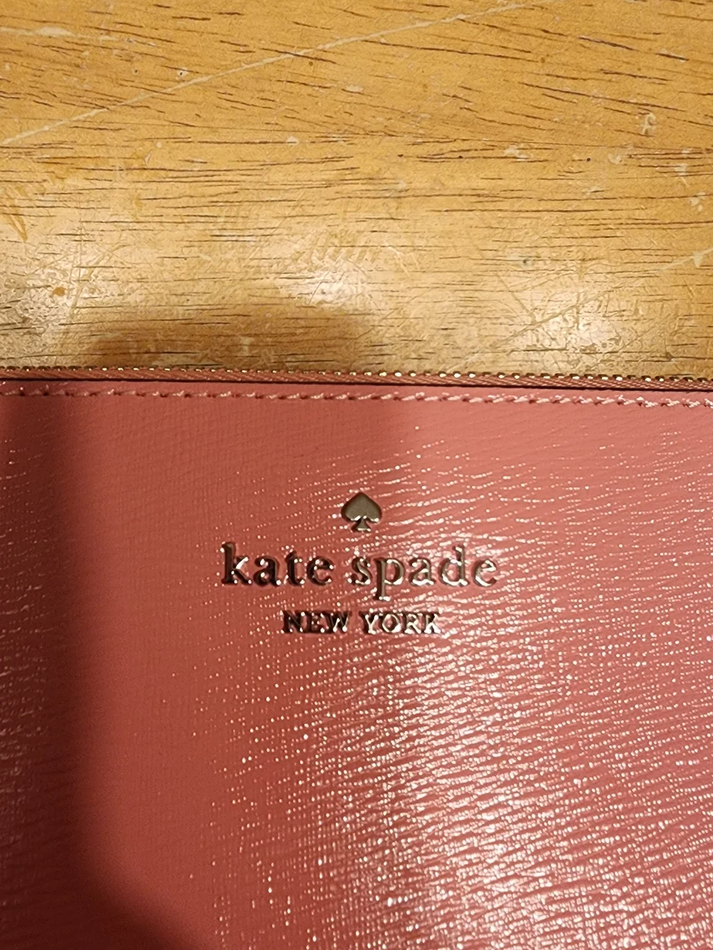Kate Spade New York Gemini Convertible Wristlet in a pink color